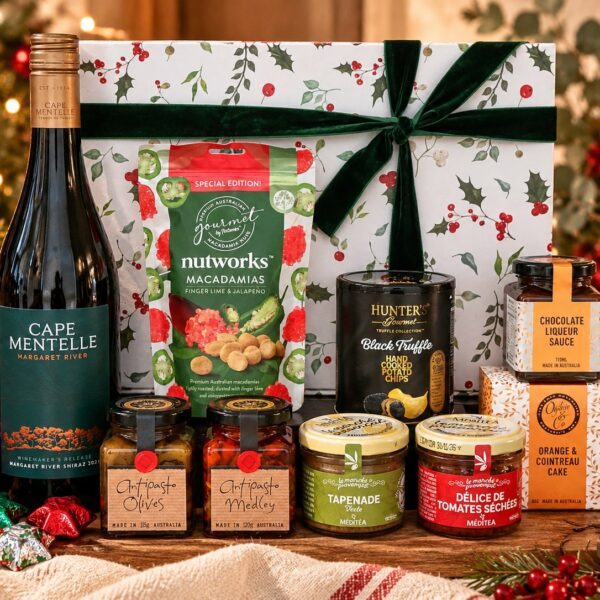 Christmas Delight gift hamper with Cape Mentelle Shiraz, gourmet savoury treats, cake and chocolates, presented with a festive holly gift box and green velvet ribbon.