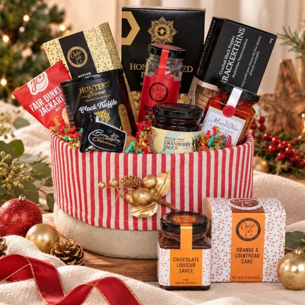 Christmas Gatherings gift hamper with sweet and savoury festive treats presented in a red and white linen cotton fruit bowl.