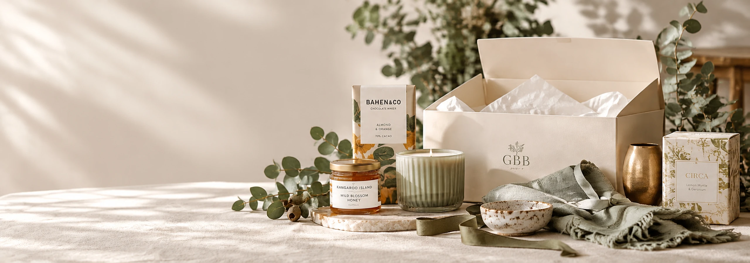 Selection of special gift items beside an open Gift Basket Boutique box